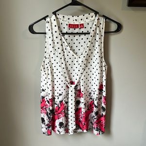 Pink poppy polka dot sleeveless blouse.
